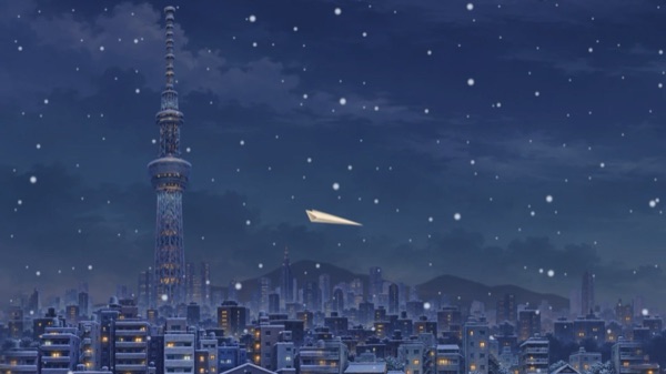 雪の東京の夜空を飛ぶ紙飛行機